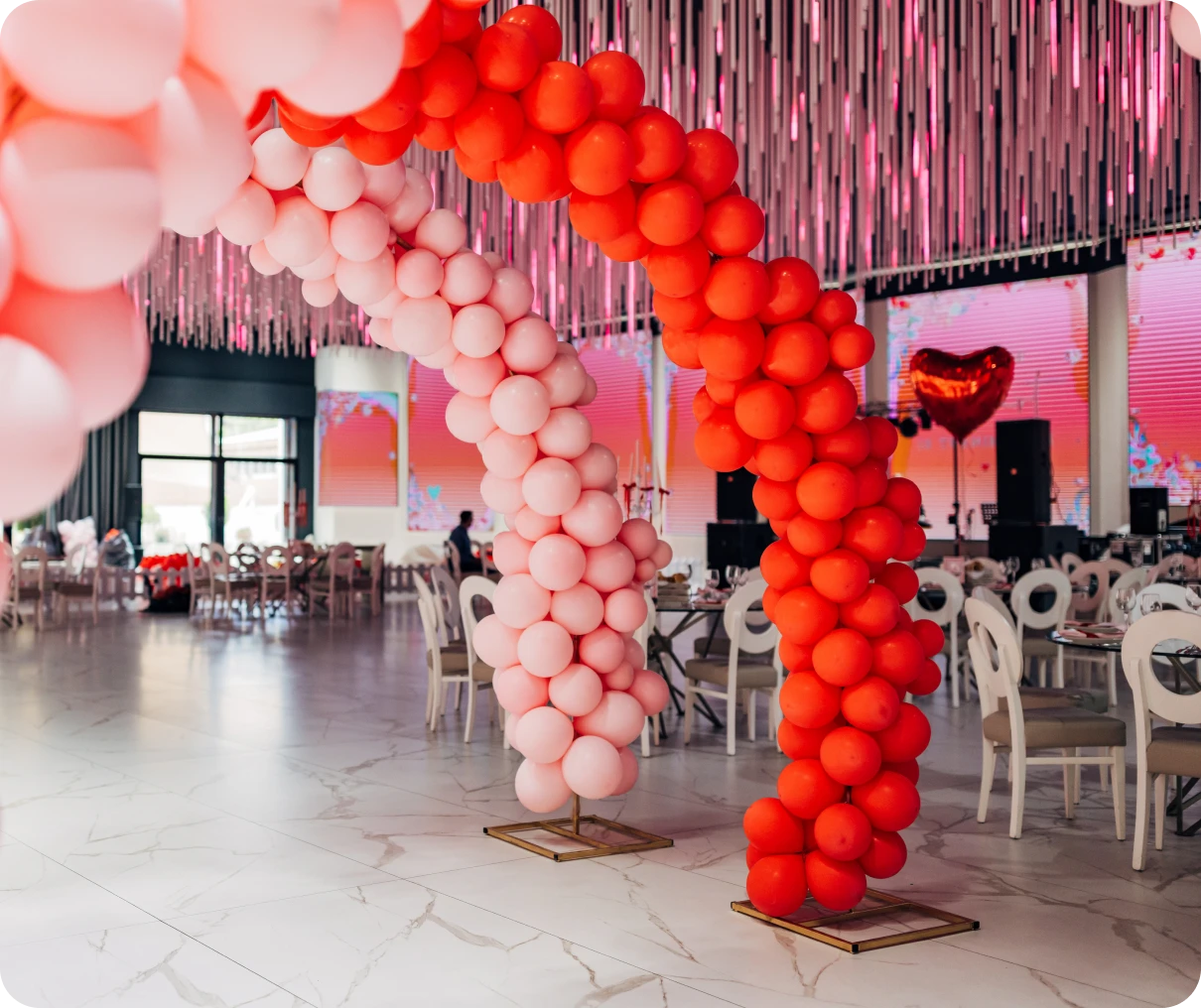 Balloon arches in decorated event hall