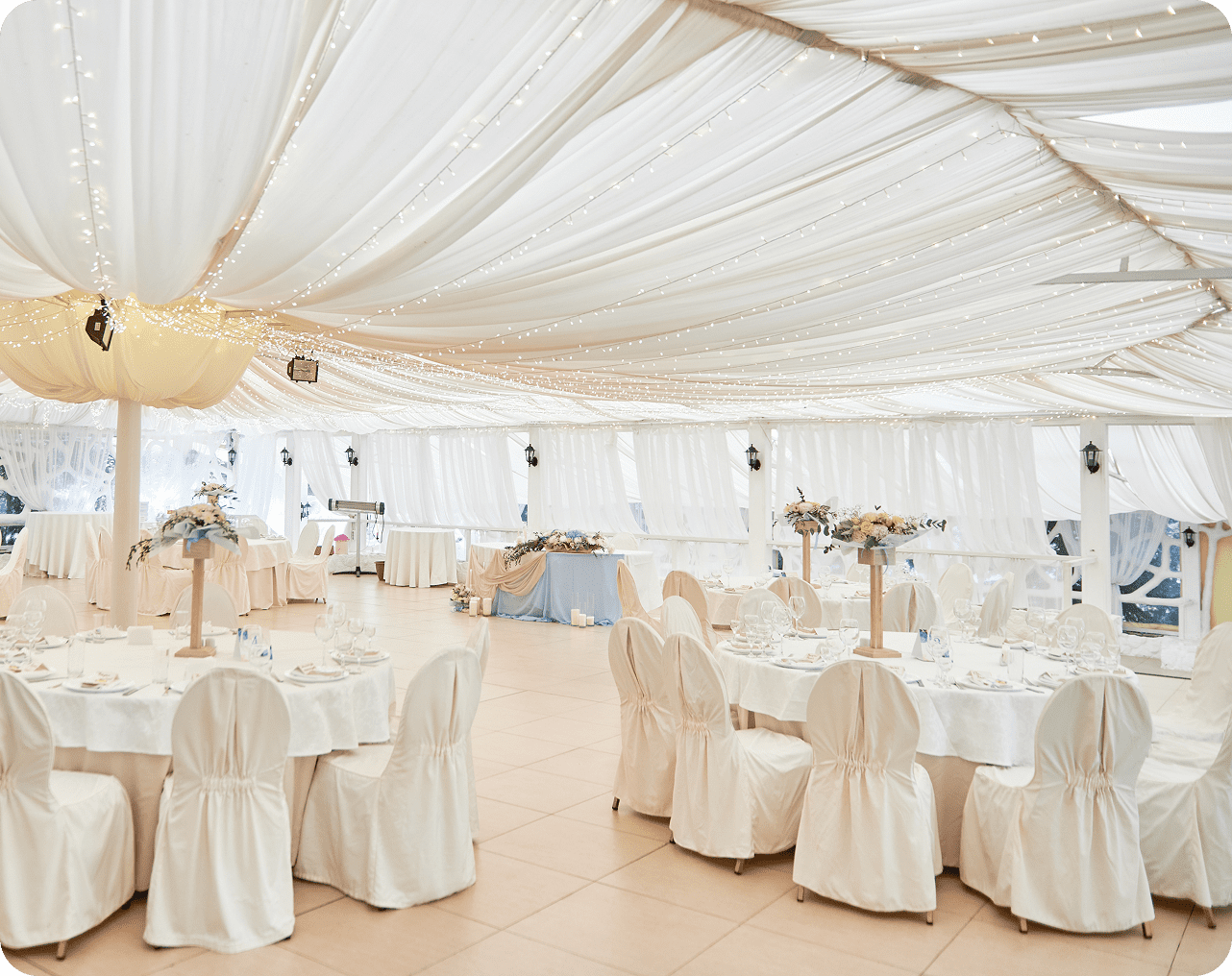 Luxurious banquet setup in a white tent