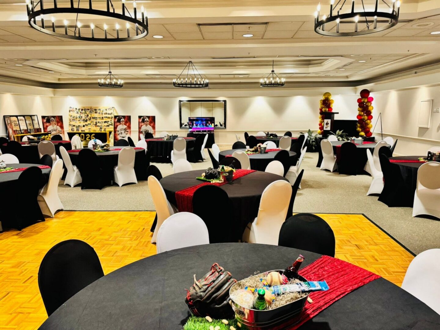 Decorated banquet hall with black and white seating